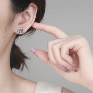 S925 sterling silver moissanite stud earrings featuring a hollow eight-pointed star design