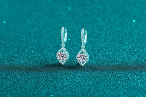 Macro detail of S925 silver moissanite earrings with geometric rhombus drop pendants