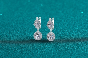 Detailed macro view of S925 silver Moissanite drop earrings with halo floral design