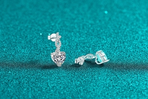 Macro view of S925 sterling silver heart earrings with moissanite pave details