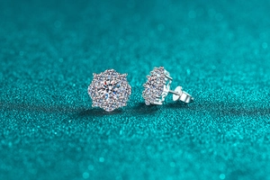 Macro shot of S925 silver snowflake earrings with sparkling moissanite flower studs