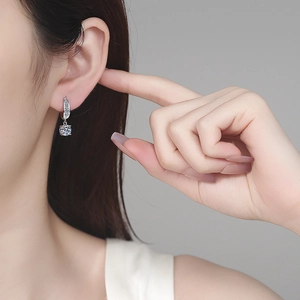 S925 Sterling Silver Moissanite drop earrings on a model with elegant side profile view