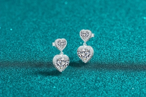 Macro detail of S925 sterling silver double heart earrings with moissanite stones