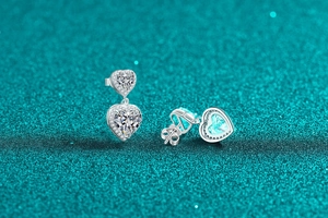Macro detail of S925 sterling silver double heart earrings with moissanite pave setting