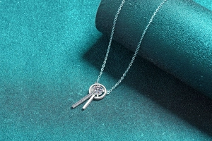 Macro view of S925 sterling silver necklace with moissanite pendant and fringe detail