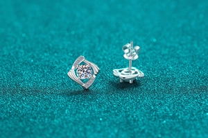 Macro view of S925 sterling silver geometric square stud earrings with moissanite stones