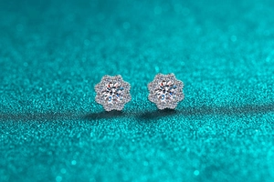 Macro shot of S925 sterling silver sunflower earrings with sparkling moissanite stones