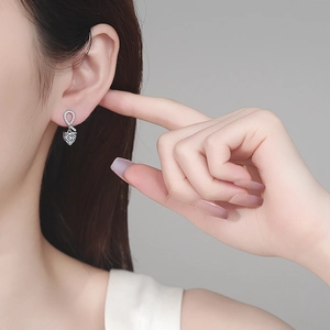 Elegant S925 sterling silver heart-shaped moissanite earrings with knot ribbon detail