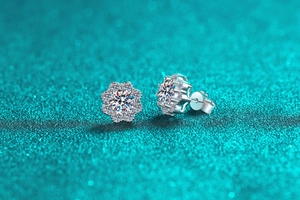 Macro shot of S925 sterling silver moissanite sunflower stud earrings with floral detail