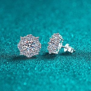 Sparkling S925 sterling silver sunflower earrings with moissanite stones on glitter background