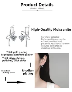 Detail of silver bow earrings with heart moissanite and multi-layer plating process