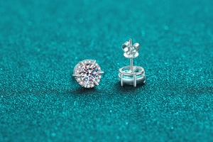 Macro shot of S925 sterling silver halo moissanite stud earrings with butterfly backs