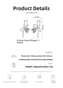 Detail of S925 sterling silver bow earrings featuring 2ct heart-shaped moissanite stones