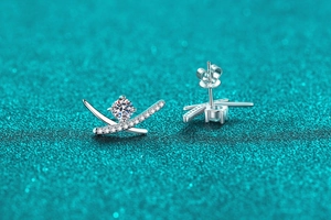 Detailed macro view of S925 sterling silver moissanite stud earrings with butterfly backs