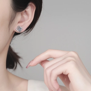 Elegant S925 sterling silver moissanite earrings with geometric vortex design