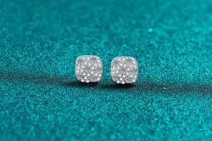 Detailed close-up of square S925 sterling silver stud earrings with pavé moissanite stones