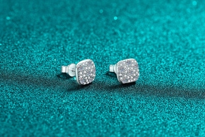 Macro detail of square S925 sterling silver moissanite stud earrings with pavé setting