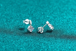 Macro shot of S925 sterling silver moissanite stud earrings with classic butterfly backs