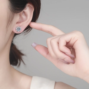 Elegant S925 sterling silver halo moissanite stud earrings shown on model