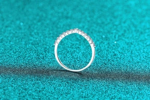 Close-up of V-shaped S925 silver ring featuring sparkling moissanite pavé setting