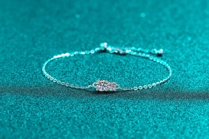 Detailed macro view of S925 sterling silver moissanite bracelet with prong-set stones