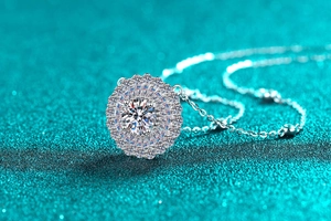 Macro shot of S925 sterling silver sunflower pendant with sparkling moissanite stones