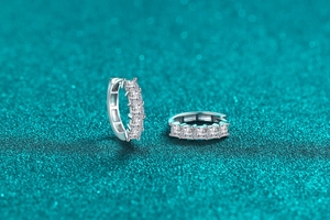 Close-up of S925 sterling silver hoop earrings with princess cut moissanite stones