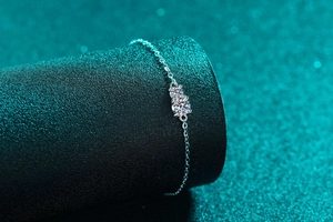 Macro shot of S925 sterling silver moissanite bracelet featuring dual round brilliant stones