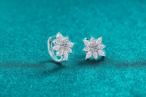 Macro view of S925 silver flower stud earrings with sparkling moissanite stones