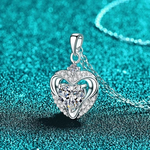 S925 sterling silver hollow heart necklace with moissanite pendant on blue background