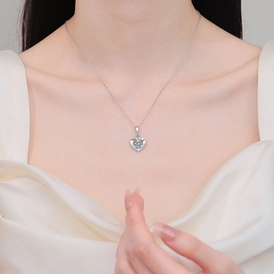 Elegant S925 sterling silver heart necklace with moissanite stone on female model