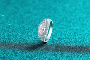 Macro detail of marquise cut moissanite silver ring with pave set sparkling accents