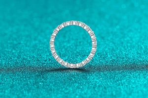 Detailed view of the S925 sterling silver eternity band with moissanite pavé stones