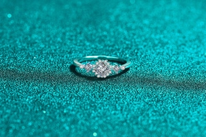 Macro shot of S925 silver moissanite ring with square halo setting and intricate details