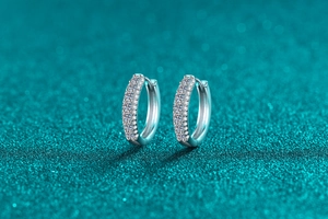 Macro view of S925 sterling silver hoop earrings with hand-set moissanite stones