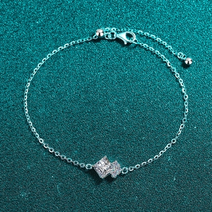 Minimalist S925 sterling silver bracelet featuring a square moissanite stone on green surface