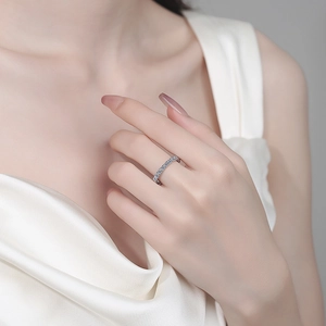 Eternity S925 sterling silver moissanite band ring on woman's finger with silk dress