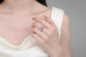 Close-up of S925 sterling silver moissanite ring with halo setting and twisted pave band