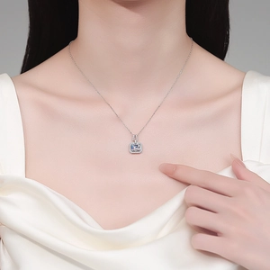 Elegant S925 sterling silver moissanite necklace with rectangular pendant on a model
