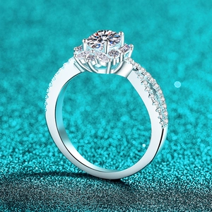 Luxurious S925 silver ring featuring an oval moissanite center with floral cluster stones
