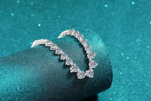 Close-up of S925 sterling silver necklace with pavé-set moissanite stones on display