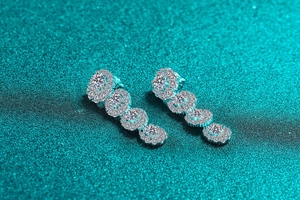 Macro detail of S925 sterling silver long tassel earrings with sparkling moissanite stones