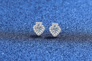 Macro shot of S925 sterling silver heart halo earrings with Moissanite stones