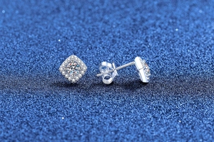 Macro shot of S925 silver square halo moissanite stud earrings with butterfly backings