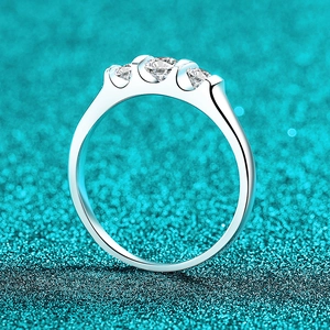 Three-stone moissanite ring in S925 sterling silver with a sleek wave design and high polish