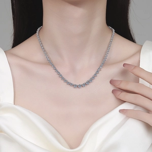 Elegant S925 sterling silver moissanite tennis necklace worn by a model in white silk