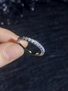 Close-up of S925 sterling silver eternity ring with sparkling moissanite diamonds