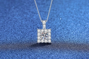 Macro shot of S925 sterling silver square moissanite pendant with elegant box chain