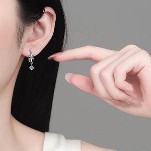Elegant S925 sterling silver butterfly tassel earrings with sparkling moissanite on model