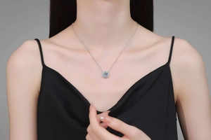 Close-up of S925 sterling silver square halo necklace with a brilliant round moissanite pendant